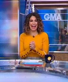 Cecilia’s orange ribbed button-cuff sweater on Good Morning America