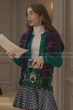 Emily’s navy and pink checked sweater and print mini skirt on Emily in Paris