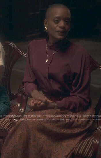 Hannah's burgundy blouse and orange paisley skirt on The Haunting of Bly Manor