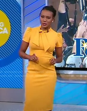 Janai’s yellow tie neck sheath dress on Good Morning America