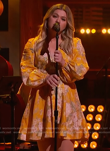 Kelly’s yellow floral print wrap dress on The Kelly Clarkson Show