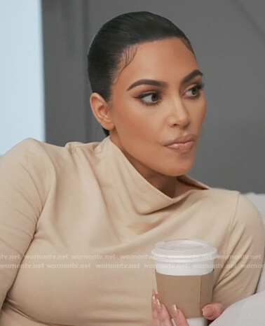 Kim's beige mock neck top on Keeping Up with the Kardashians