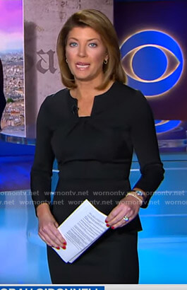 Norah's black twisted neck peplum top on CBS Evening News