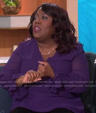 Sheryl’s purple sheer top on The Talk