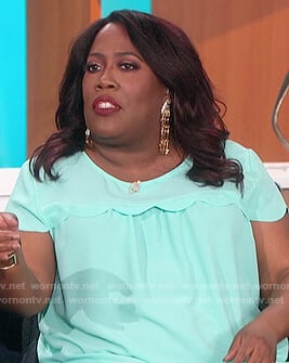 Sheryl’s light blue scallop trim top on The Talk