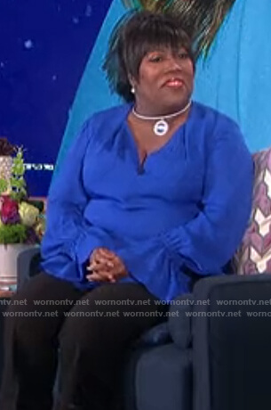 Sheryl's blue ruffle cuff blouse on The Talk