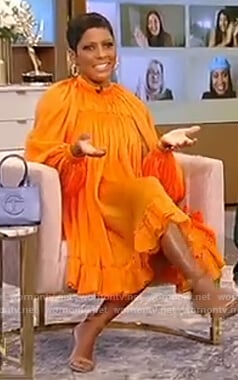 Tamron’s orange satin dress on Tamron Hall Show