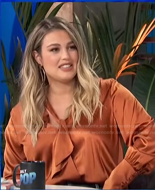 Carissa’s orange tie neck satin blouse on E! News Daily Pop