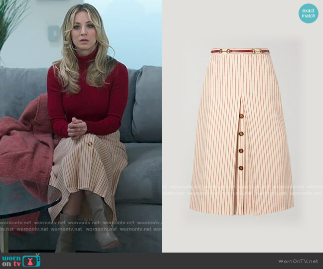 Gucci Leather-trimmed paneled pinstriped wool midi skirt worn by Cassie Bowden (Kaley Cuoco) on The Flight Attendant