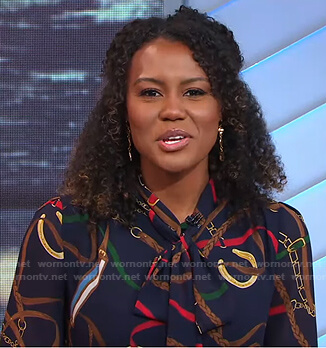 Janai’s navy belt print tie neck blouse on Good Morning America