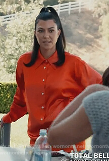 Kourtney's orange satin shirt on Keeping Up with the Kardashians