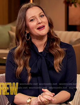 Drew’s blue tie neck blouse and pleated skirt on The Drew Barrymore Show