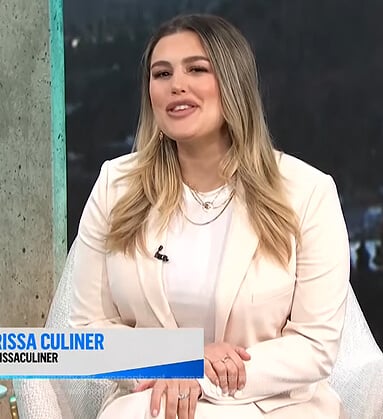 Carissa’s white fringe blazer and pants on E! News Daily Pop