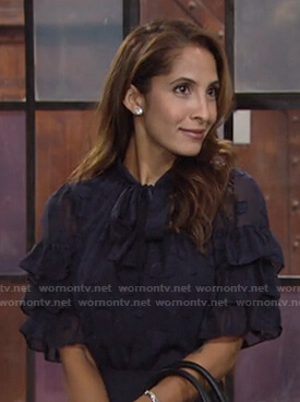 Lily’s navy tie neck ruffled sleeve top on The Young and the Restless