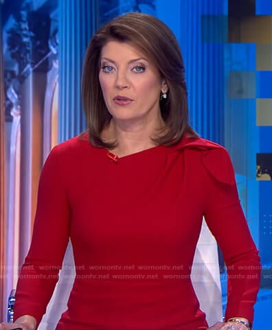 Norah’s red gathered shoulder dress on CBS Evening News