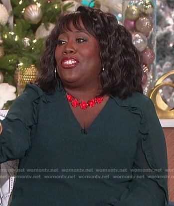 Sheryl’s green ruffle blouse and necklace on The Talk