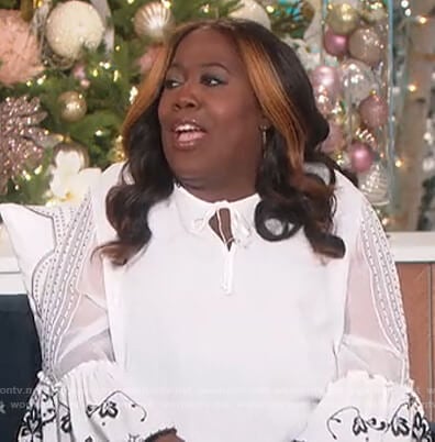 Sheryl’s white floral embroidered blouse on The Talk