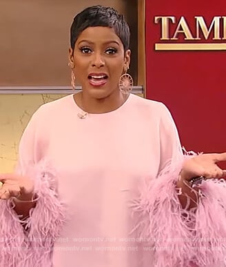 Tamron’s pink feather trim dress on Tamron Hall Show