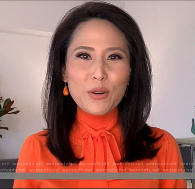 Vicky’s orange tie neck knit top on Today