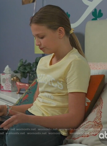 Anna’s yellow Athelics print tee on American Housewife