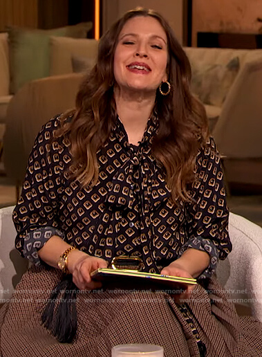 Drew’s geometric print tie neck blouse and check skirt by Drew Barrymore Show