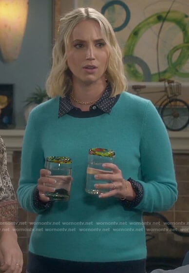 Mandy's turquoise sweater with navy trim on Last Man Standing