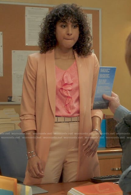 Mikaela's pink ruffled front top and long coral jacket on Mr Mayor