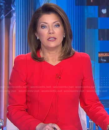 Norah’s red pleated jacket on CBS Evening News
