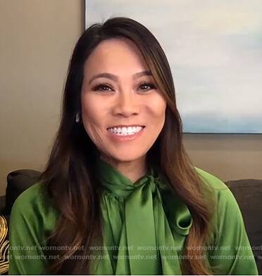 Sandra Lee's green satin tie neck blouse on E! News