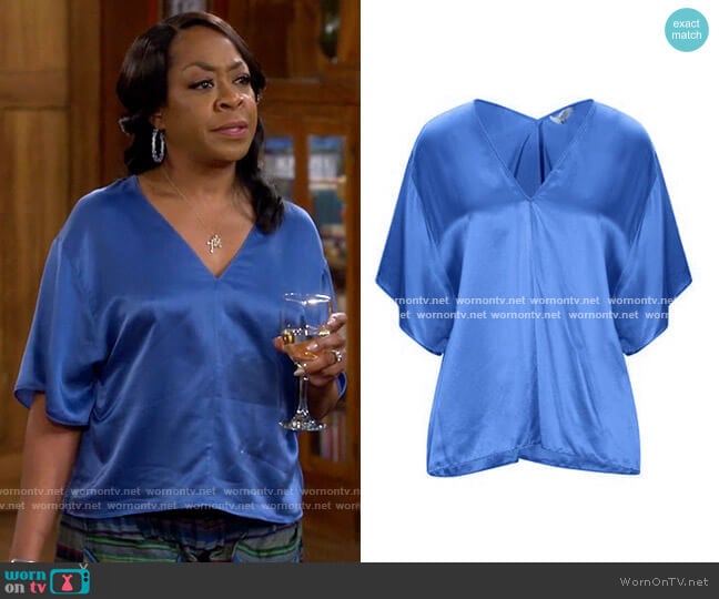 WornOnTV: Tina’s blue v-neck top and striped pants on The Neighborhood ...