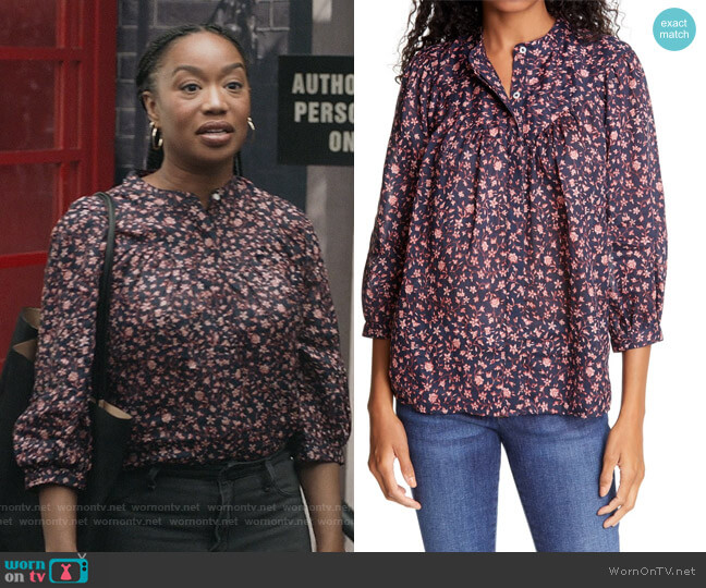 Michelle’s black floral print blouse on The Unicorn