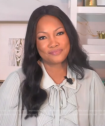 Garcelle’s mint ruffle front blouse on The Real