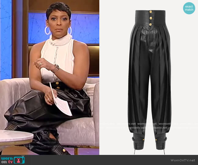 Pleated leather tapered pants by Gucci worn by Tamron Hall on Tamron Hall Show