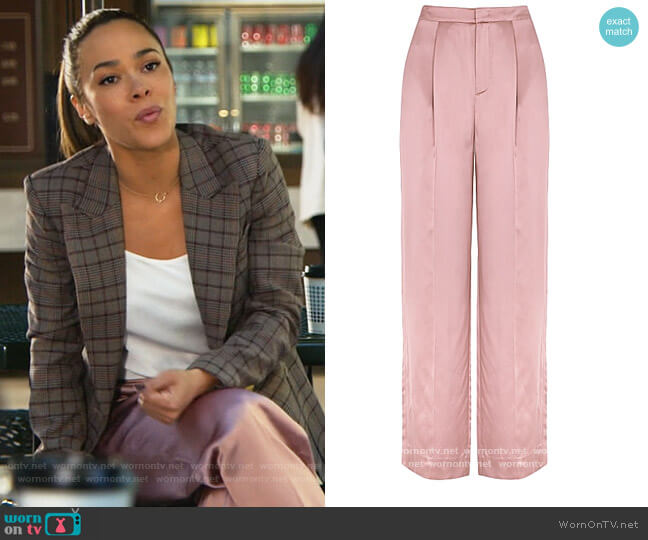 Blush wide-leg satin trousers by Vince worn by Emily Lopez (Jessica Camacho) on All Rise