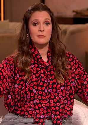 Drew’s black lip print tie neck blouse on The Drew Barrymore Show