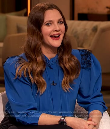 Drew’s blue lace trim tie neck blouse on The Drew Barrymore Show