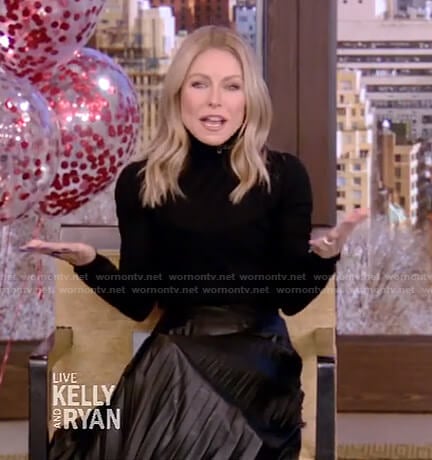 Kelly’s black turtleneck sweater and pleated skirt on Live with Kelly and Ryan