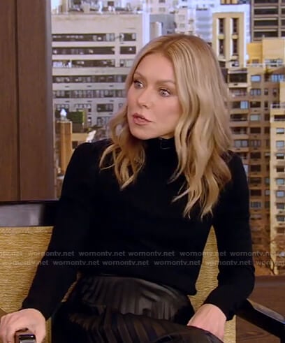 Kelly's black turtleneck sweater and pleated skirt on Live with Kelly and Ryan