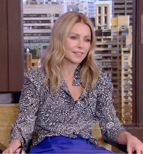 Kelly's black paisley blouse and blue pants on Live with Kelly and Ryan