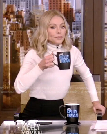 Kelly’s white turtleneck sweater and black skirt on Live with Kelly and Ryan