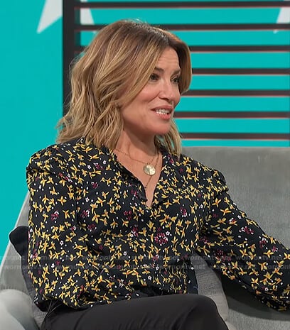 Kit’s black and yellow floral blouse on Access Hollywood