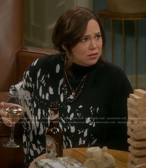 Kristin's black splatter print turtleneck sweater on Last Man Standing