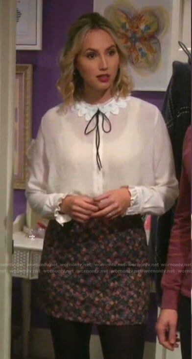 Mandy’s white lace collar blouse and floral skirt on Last Man Standing