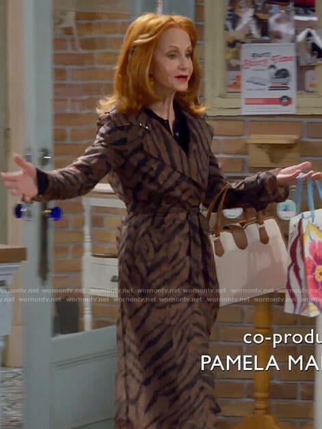 Sheila’s tiger stripe trench coat on Call Me Kat