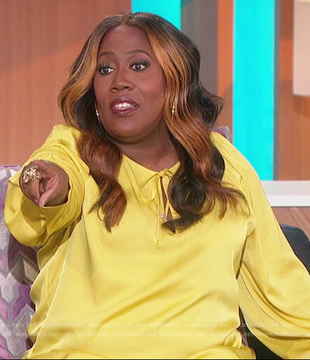 Sheryl’s yellow satin tie neck blouse on The Talk