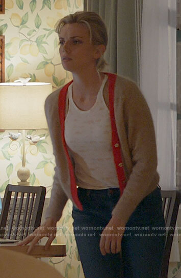 Sylvie's floral tank top and tan cardigan with red trim on Chicago Fire