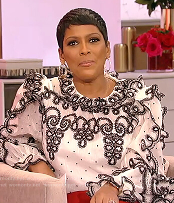 Tamron's white embroidered lace trim blouse on Tamron Hall Show