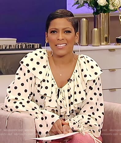 Tamron’s white polka dot ruffle blouse on Tamron Hall Show