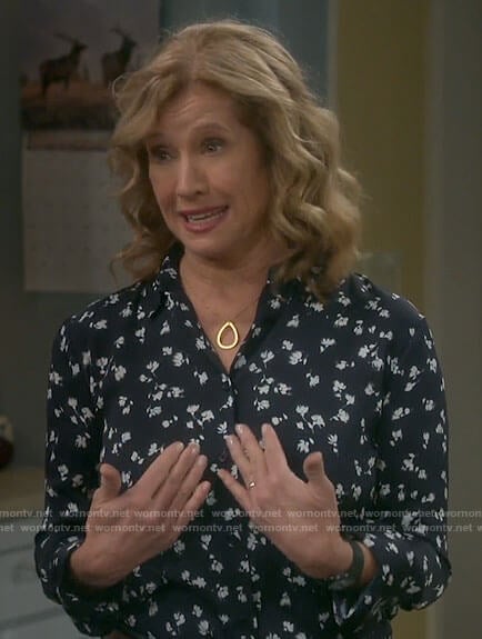 Vanessa’s navy floral button down top on Last Man Standing