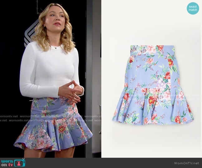 WornOnTV: Emily's turquoise blue cardigan and printed pleated mini